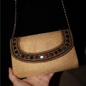 Handcrafted Jute clutch from India with gold chain and multicolor glass beads.